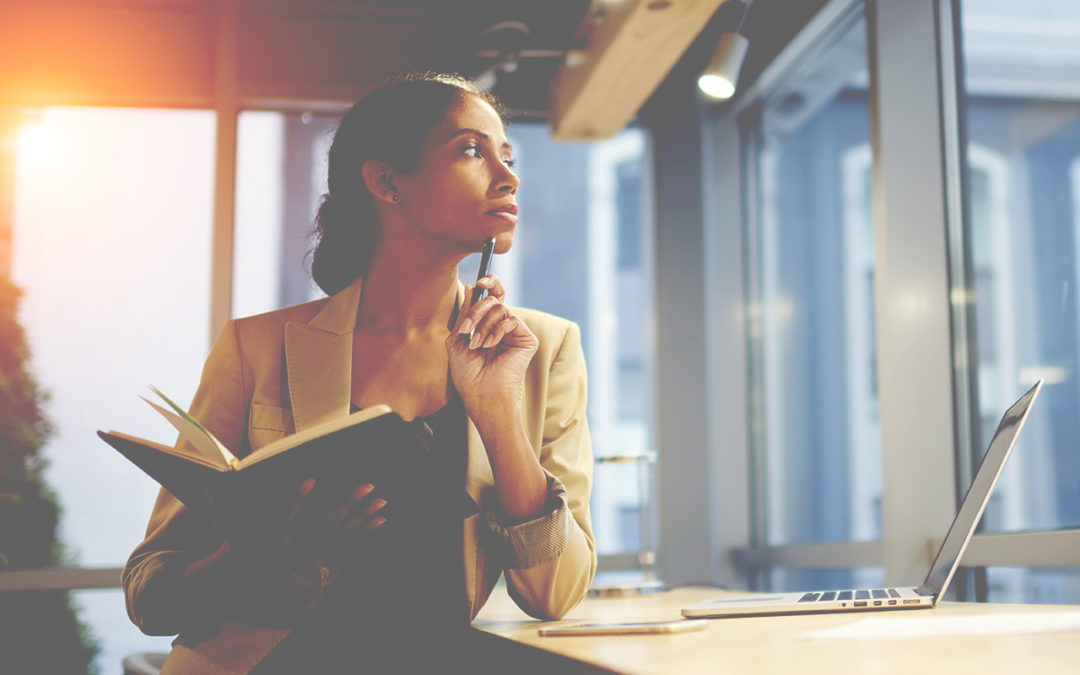 Business woman contemplating information from report